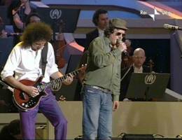 Concert photo: Brian May + Roger Taylor live at the Parco Novi Sad, Modena, Italy (Pavarotti & Friends) [27.05.2003]